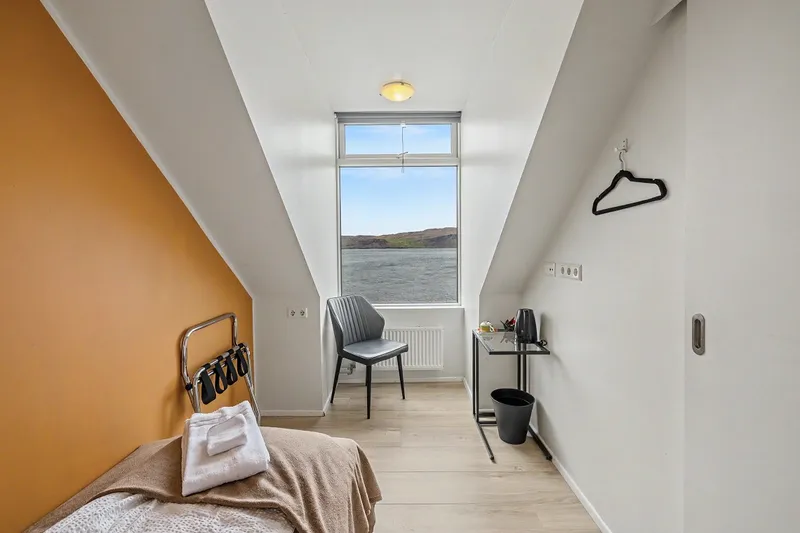 Single room with comfortable bed and view